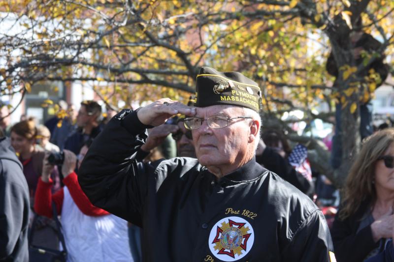 Paul Musiol, a former Marine, salutes during the singing of the National Anthem at Wareham’s Veterans Day ceremony in front of Town Hall. BY MATTHEW BERNAT